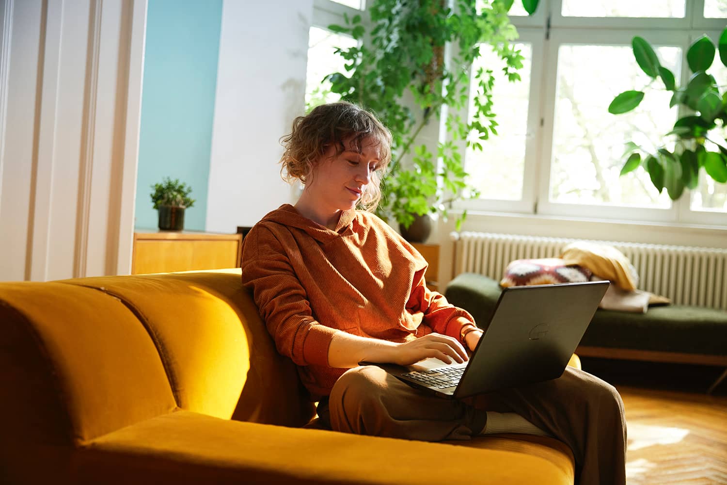 Girl booking a trip for her and her best friend from her couch